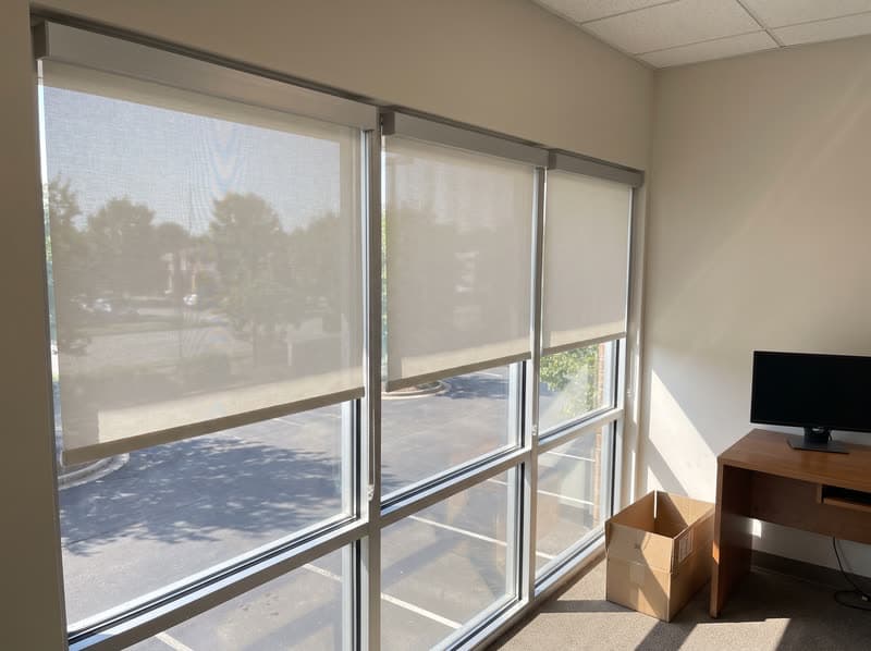 Motorized roller shades across an office window bank in Peachtree Corners