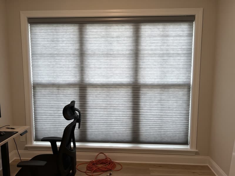 Slate blackout cellular shade fully lowered in a Lawrenceville home office